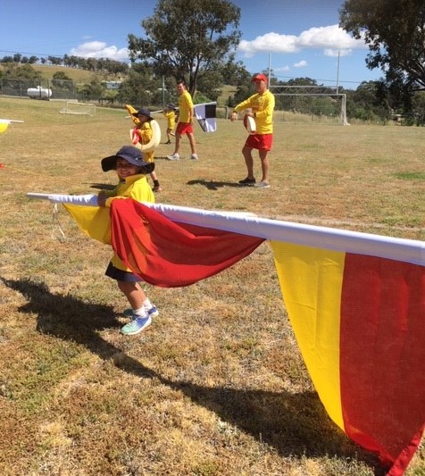 School-student-with-red&yellow-flag